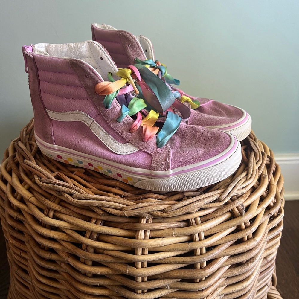 Girls pink suede high top vans, checkered soles, rainbow laces